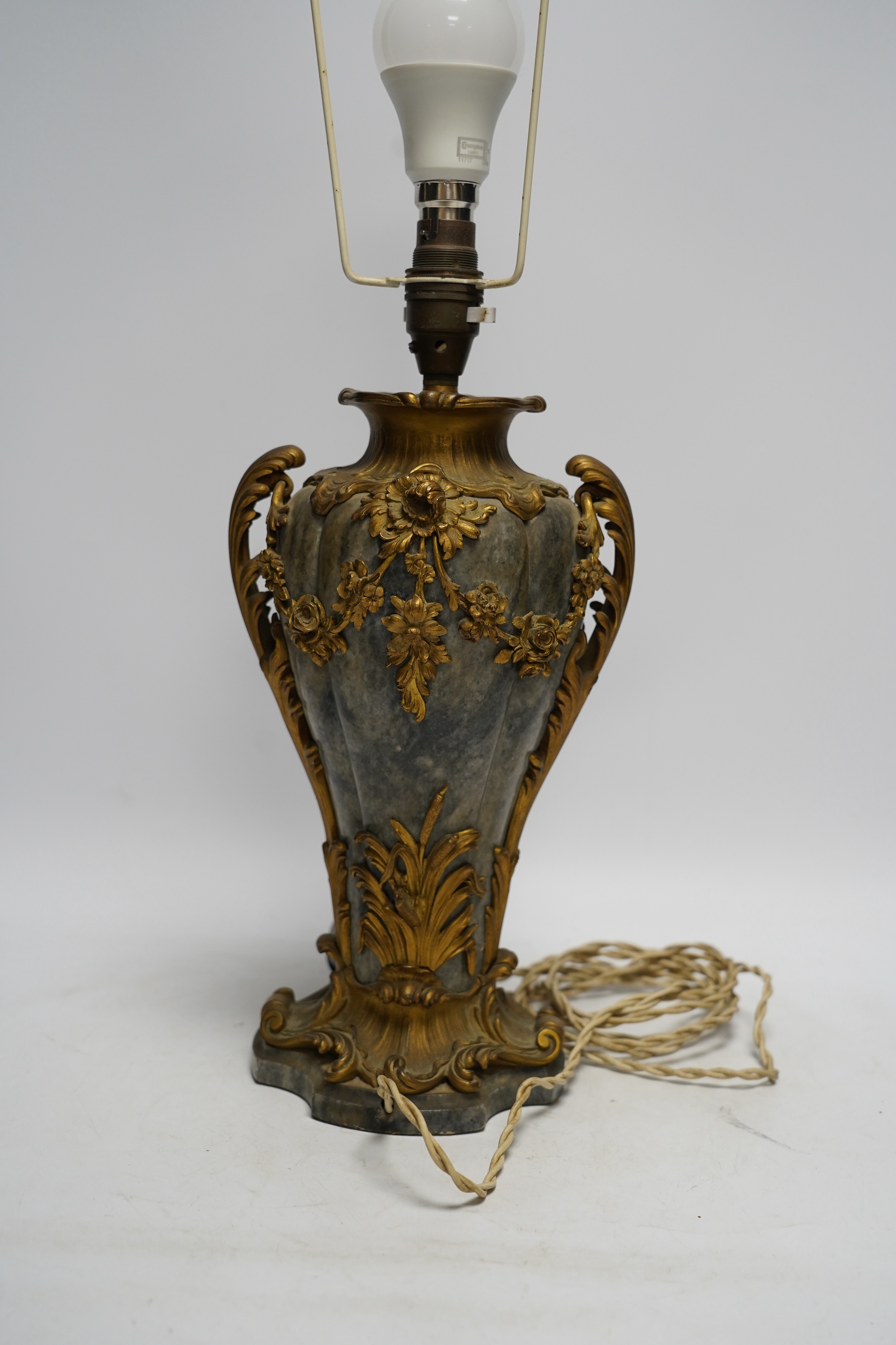 A 19th century French rococo style ormolu mounted grey marble lamp, converted to electricity, 29cm excluding light fittings